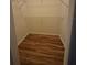 Empty walk-in closet features wood flooring and wire shelving at 30434 Colehaven Ct, Wesley Chapel, FL 33543