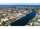 Stunning aerial view of the waterfront community with homes, canals, and boat docks at 3235 Seaway Dr, New Port Richey, FL 34652