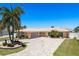 Beautiful single-story home with a spacious driveway, lush landscaping, and a well-manicured lawn at 3235 Seaway Dr, New Port Richey, FL 34652