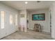 Entryway featuring tiled floors, a decorative front door with sidelights, and an artistic flair through whimsical decor at 3235 Seaway Dr, New Port Richey, FL 34652
