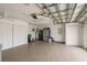 Spacious garage with epoxy floors, ample storage, and overhead door opener at 3235 Seaway Dr, New Port Richey, FL 34652
