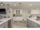 Open kitchen layout with dual islands, marble countertops, and ample cabinet space, ideal for culinary enthusiasts at 3235 Seaway Dr, New Port Richey, FL 34652