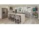 Spacious kitchen with a large island, seating, stainless steel appliances, and seamless flow to adjacent living spaces at 3235 Seaway Dr, New Port Richey, FL 34652