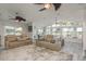 Spacious living room with multiple sofas, large windows, and scenic views, creating a serene and inviting atmosphere at 3235 Seaway Dr, New Port Richey, FL 34652