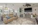 Comfortable living room with a cozy sofa, large TV, and stylish decor, perfect for relaxation and entertainment at 3235 Seaway Dr, New Port Richey, FL 34652