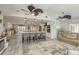 Open-concept living room with a kitchen island, comfortable seating, and stylish design, perfect for modern living at 3235 Seaway Dr, New Port Richey, FL 34652