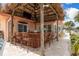 Relax at the covered outdoor bar with seating, a TV and beautiful views at 3235 Seaway Dr, New Port Richey, FL 34652