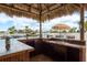 Covered outdoor kitchen area with stainless steel sink and room for refreshments at 3235 Seaway Dr, New Port Richey, FL 34652