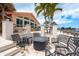 Charming outdoor patio with a fire pit, comfortable seating, and serene water views at 3235 Seaway Dr, New Port Richey, FL 34652