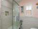 Beautiful shower with updated tile work, glass door, and a built-in niche at 3235 Seaway Dr, New Port Richey, FL 34652