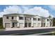 Charming townhomes with a neutral exterior color scheme and individual garages at 3514 Marigold Patch Ct, Plant City, FL 33565