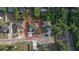 Aerial view of a single Gathering home on a tree lined street, showcasing the property layout and surroundings at 37565 Teri Ct, Dade City, FL 33525