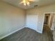 This bedroom features a closet and wood-look floors for a modern look at 37565 Teri Ct, Dade City, FL 33525