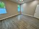 Bedroom with tile floors, neutral color palette, ample natural light, and ceiling fan at 37565 Teri Ct, Dade City, FL 33525