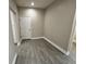 Hallway and bonus room showcasing the tile floors and natural light from multiple angles at 37565 Teri Ct, Dade City, FL 33525