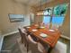 Elegant dining room featuring a stylish light fixture and a wood table set for six, perfect for Gathering gatherings at 37565 Teri Ct, Dade City, FL 33525