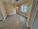 Inviting dining area featuring modern chandelier lighting, a large window, and tile flooring, perfect for gatherings at 37565 Teri Ct, Dade City, FL 33525