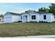 Beautiful one-story home with a well-maintained lawn and a clean, white facade that welcomes you at 37565 Teri Ct, Dade City, FL 33525