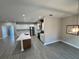 Open concept kitchen with modern appliances and kitchen island with quartz countertops at 37565 Teri Ct, Dade City, FL 33525