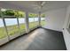 Enclosed lanai with a concrete floor and views of the spacious, fenced backyard at 37565 Teri Ct, Dade City, FL 33525
