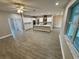 Open living area with tile flooring, recessed lighting, and a bright window, creating a welcoming atmosphere at 37565 Teri Ct, Dade City, FL 33525