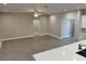 Open-concept living area with tile flooring, neutral paint, and ample space for flexible furniture arrangements at 37565 Teri Ct, Dade City, FL 33525