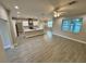 Spacious open-concept living area with modern finishes and abundant natural light from strategically placed windows at 37565 Teri Ct, Dade City, FL 33525