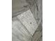 Modern shower with marble tile and pebble floor at 37565 Teri Ct, Dade City, FL 33525
