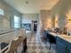 Elegant bathroom with a glass shower, soaking tub, dual vanities, and patterned tile floors at 4294 Cork Rd, Plant City, FL 33565