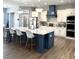 Gourmet kitchen featuring a large island, stainless steel appliances, and custom cabinetry at 4294 Cork Rd, Plant City, FL 33565