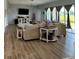 Spacious living room with hardwood floors, lots of natural light, and comfortable seating at 4294 Cork Rd, Plant City, FL 33565