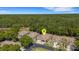 A bird's eye view of a home in a vibrant community close to a forested area at 4425 Connery Ct, Palm Harbor, FL 34685