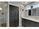 Modern bathroom featuring double vanity with marble countertop and walk-in shower at 4425 Connery Ct, Palm Harbor, FL 34685