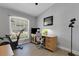 Bright office area with light wood floors, a large window and modern furniture at 4425 Connery Ct, Palm Harbor, FL 34685