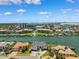 Beautiful aerial view featuring waterfront homes and condos with boat docks in a lush community at 6202 Pasadena Point Blvd, Gulfport, FL 33707