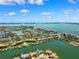 Scenic aerial shot of a waterfront community with condos, boat docks, and open water views at 6202 Pasadena Point Blvd, Gulfport, FL 33707