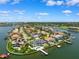 Aerial view of waterfront homes featuring boat docks and swimming pools at 6202 Pasadena Point Blvd, Gulfport, FL 33707