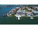 Stunning waterfront home featuring a private dock and swimming pool, perfect for luxury living at 6202 Pasadena Point Blvd, Gulfport, FL 33707