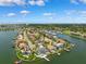 Captivating aerial view featuring stunning waterfront residences, private docks, and lush tropical landscaping at 6202 Pasadena Point Blvd, Gulfport, FL 33707