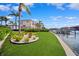 Beautiful backyard with lush landscaping and water views at 6202 Pasadena Point Blvd, Gulfport, FL 33707