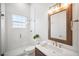 Beautiful bathroom featuring a glass enclosed shower, modern fixtures, and sleek vanity at 6202 Pasadena Point Blvd, Gulfport, FL 33707