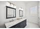Spacious bathroom featuring double sinks, decorative mirrors, and ample counter space at 6202 Pasadena Point Blvd, Gulfport, FL 33707