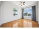 Bright bedroom with gorgeous water views from expansive windows and wood flooring at 6202 Pasadena Point Blvd, Gulfport, FL 33707