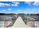 View of a private dock with boat lift access, surrounded by waterfront scenery at 6202 Pasadena Point Blvd, Gulfport, FL 33707
