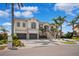 Elegant two-story home with a three-car garage and beautifully landscaped front yard at 6202 Pasadena Point Blvd, Gulfport, FL 33707