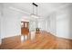 Bright foyer featuring hardwood floors, chandelier, and arched doorways leading to other rooms at 6202 Pasadena Point Blvd, Gulfport, FL 33707