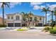 Charming two-story home with a three-car garage, landscaped front yard, and inviting curb appeal at 6202 Pasadena Point Blvd, Gulfport, FL 33707