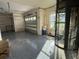 Large garage with speckled epoxy floors, storage, and an elevator for convenient access at 6202 Pasadena Point Blvd, Gulfport, FL 33707