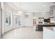 Bright kitchen features tile flooring, stainless appliances, and white cabinetry at 6202 Pasadena Point Blvd, Gulfport, FL 33707