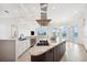 Bright kitchen with granite counters, stainless appliances, and large island cooktop at 6202 Pasadena Point Blvd, Gulfport, FL 33707